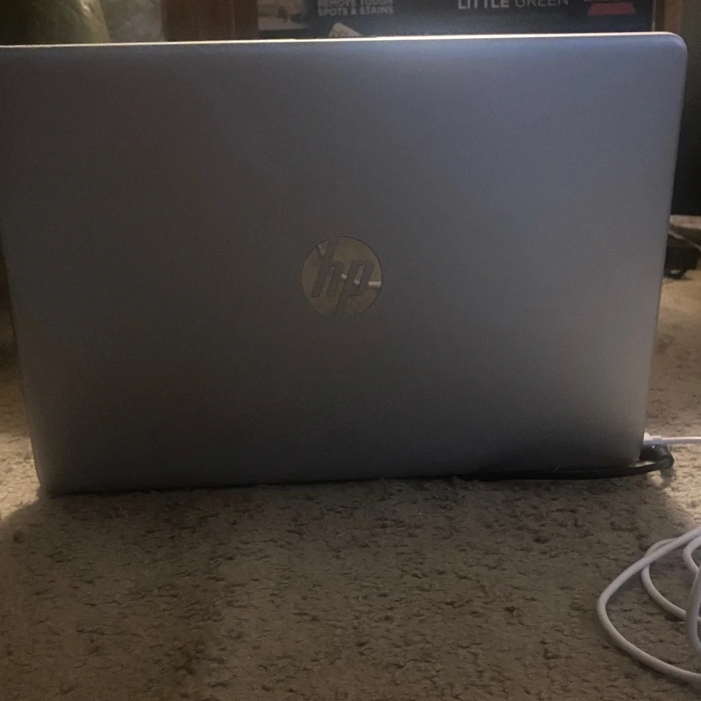 HP Silver Laptop with Blue Screen
